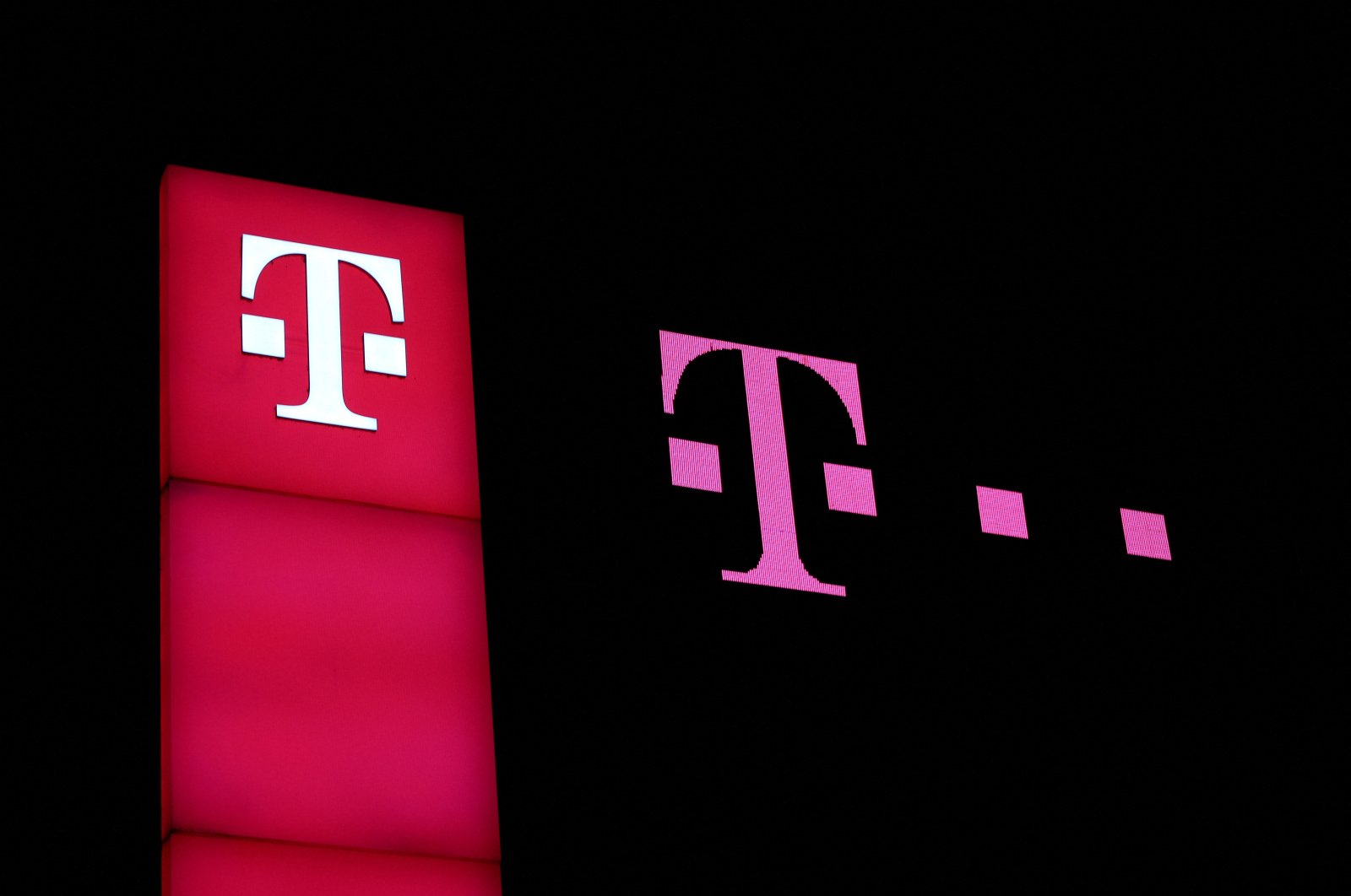 Deutsche Telekom signs are pictured at the headquarters of the German telecoms giant in Bonn, Germany, March 20, 2022. (Reuters Photo)