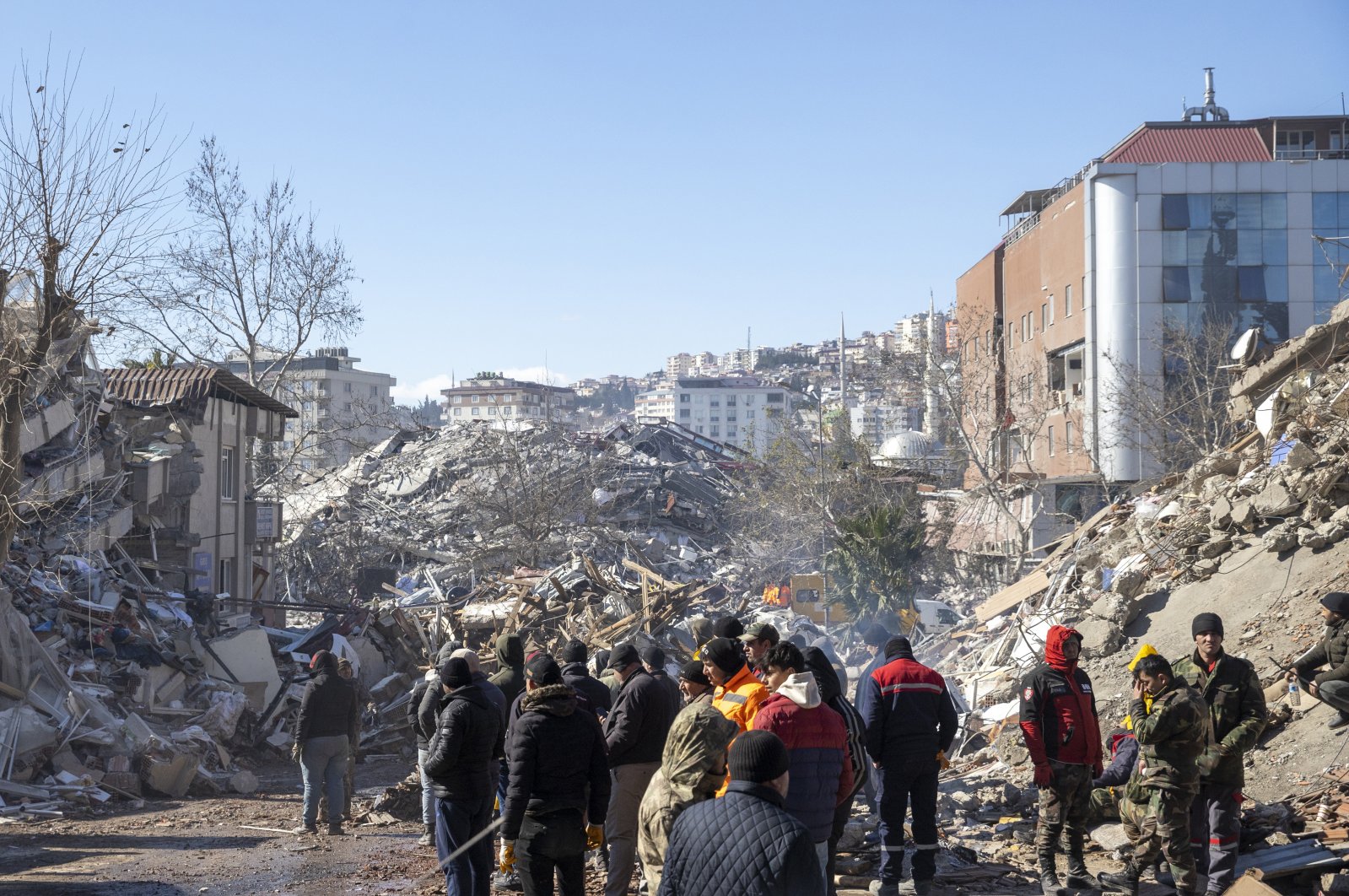 People work at the site of a collapsed building, in the aftermath of the deadly earthquake, Kahramanmaraş, Türkiye, Feb. 8, 2023. (AA Photo)