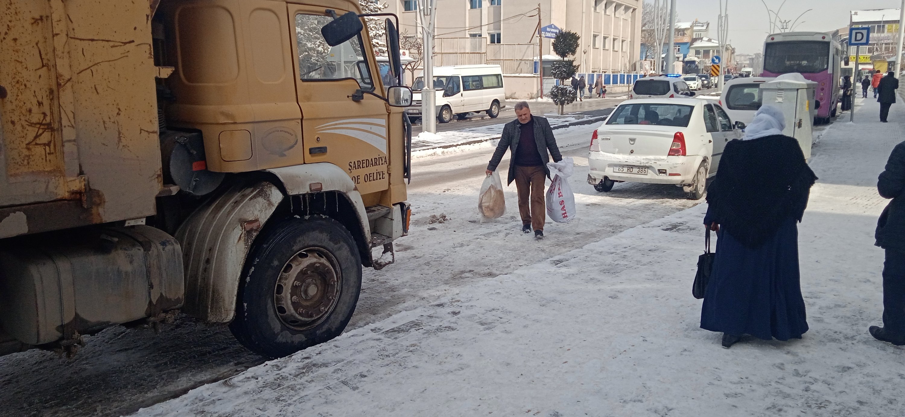 Mehmet Tak in Türkiye's Van delivers flour to the village women, Van, Türkiye, Feb. 9. 2023. (IHA Photo)
