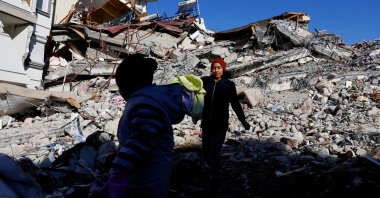 Children stand amid rubble in Pazarcık, Kahramanmaraş, southern Türkiye, Feb. 9, 2023. (Reuters Photo)
