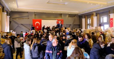 People collecting donated materials within the scope of the aid campaign launched for earthquake victims, in the Aegean province Balıkesir's Ayvalık, Türkiye, Feb. 9, 2023. (IHA Photo)