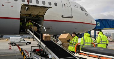 Staff load medical supplies and tents, as part of Greece's humanitarian aid to Türkiye's earthquake-stricken region at the international airport in Spata near Athens on Feb. 9, 2023. (AFP Photo)