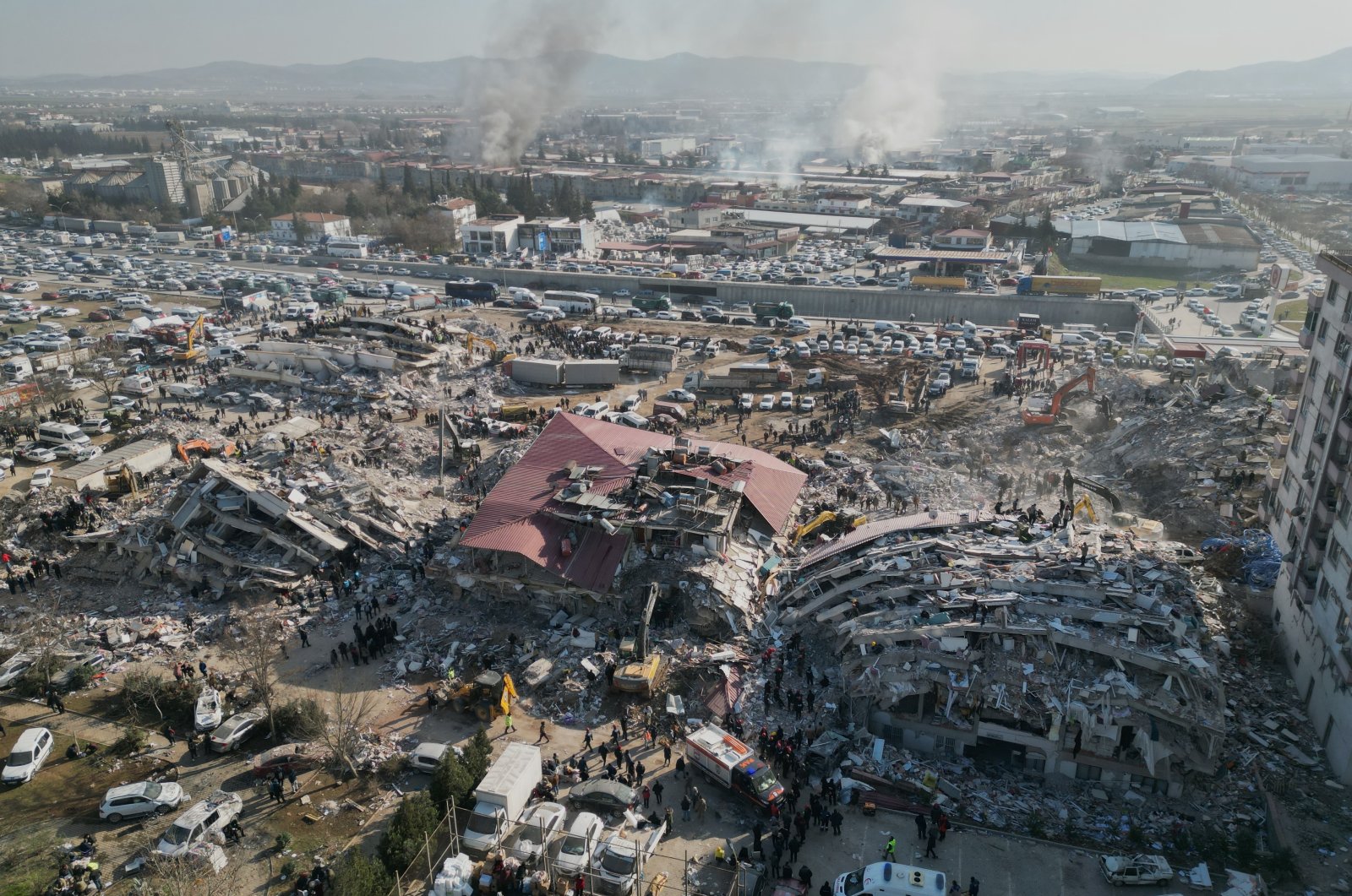  A photo taken with a drone shows emergency services working among the rubble of collapsed buildings in the aftermath of two powerful earthquakes in Kahramanmaraş, southeastern Türkiye, Feb. 9, 2023. (EPA Photo)