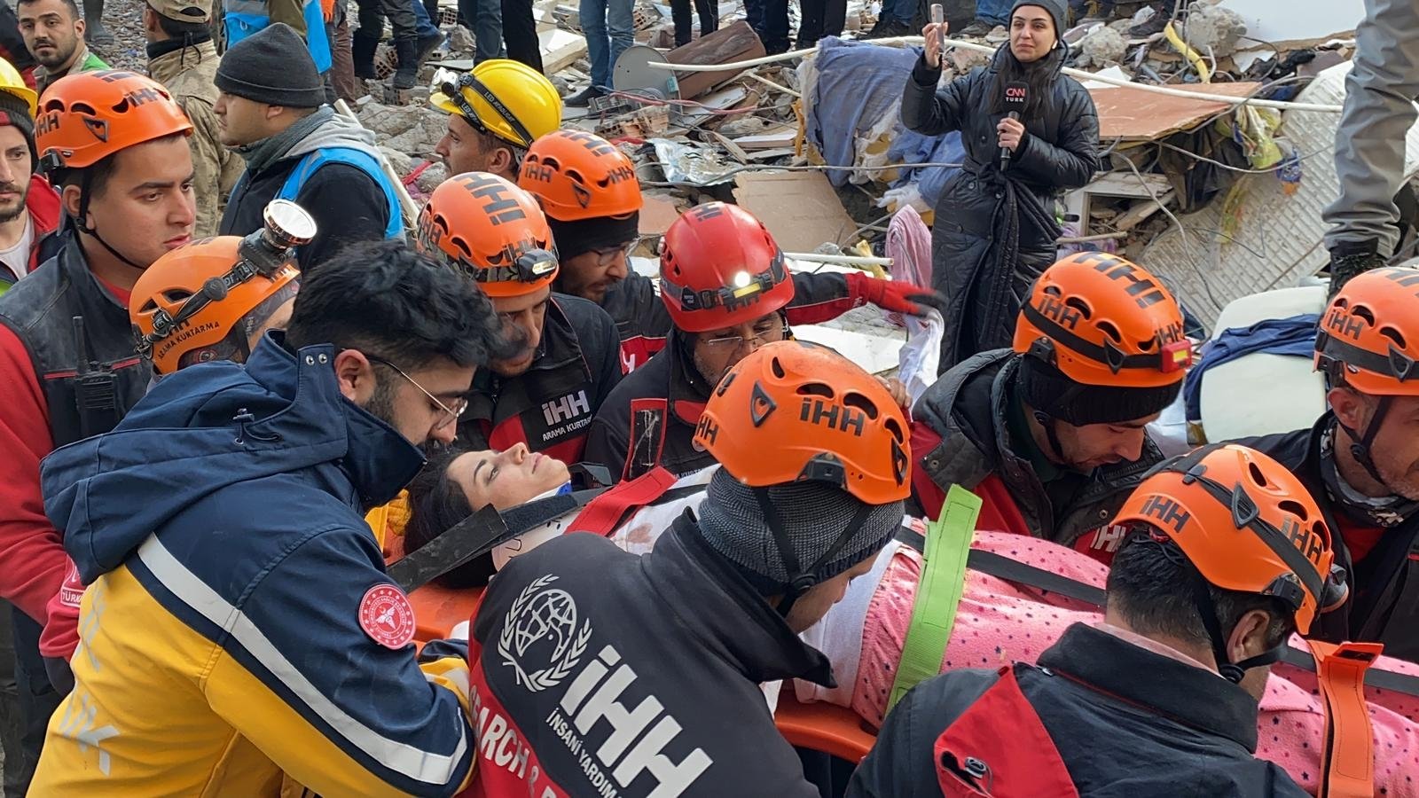 A woman is carried on a stretcher after being pulled out of the rubble of her home in the Iskenderun district of Türkiye&#039;s southern Hatay province 102 hours after the devastating earthquakes, Feb. 10, 2023. (DHA Photo)