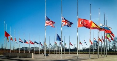 The flags of the NATO member states fly at half mast at the alliance's headquarters, Brussels, Belgium, Feb. 7, 2023. (AA Photo)
