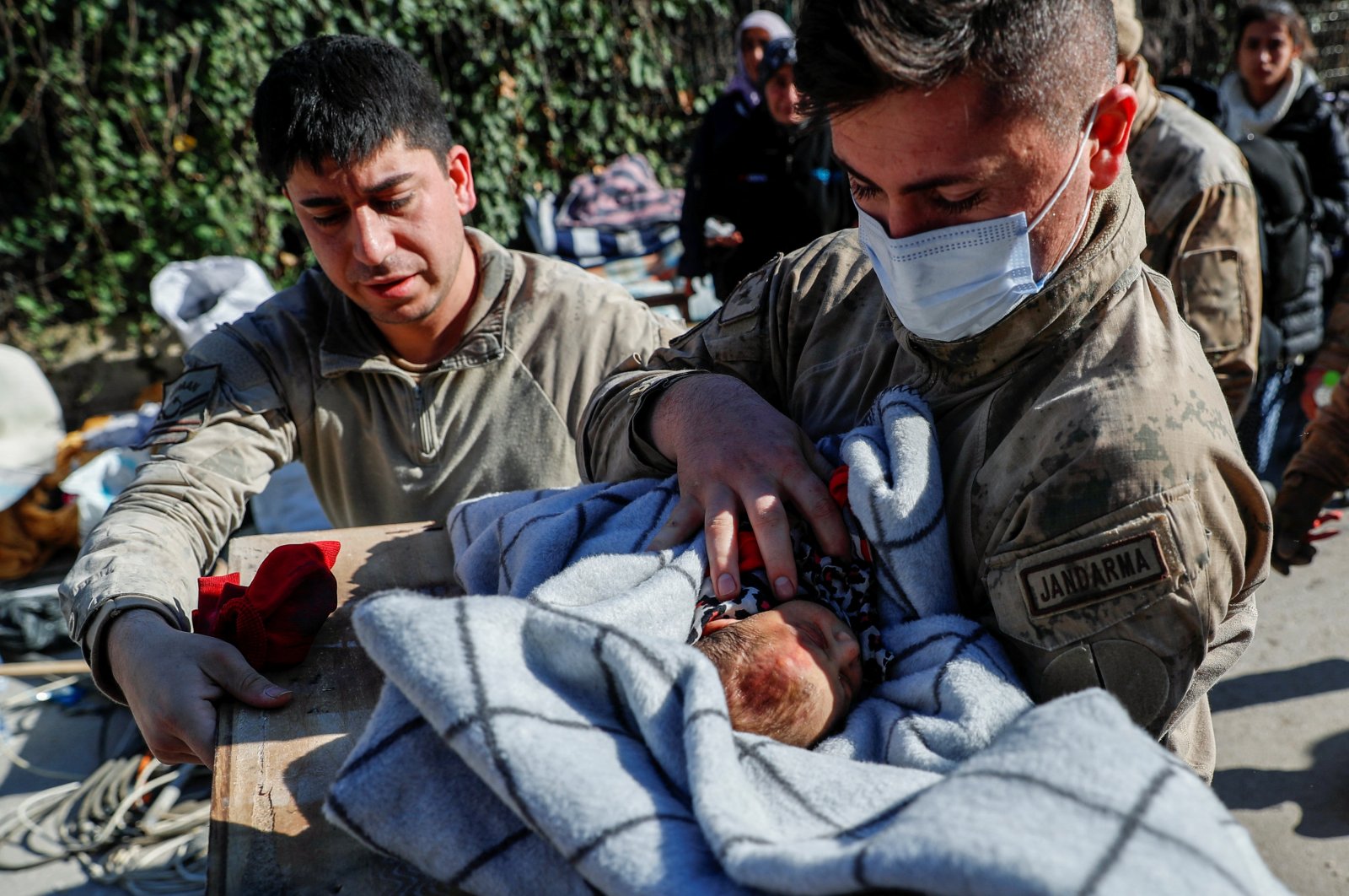 Rescuers carry baby boy Kerem Ağirtaş, a 20-day-old survivor who was pulled from under the rubble, in the aftermath of a deadly earthquake in Hatay, Türkiye, Feb. 8, 2023. (Reuters Photo)