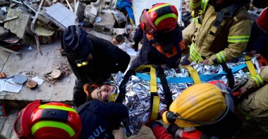 Rescuers evacuate a 12-year-old girl, Cudi, from the rubble, in Hatay, southern Türkiye, Feb. 12, 2023. (AFP Photo)