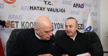 Turkish FM Mevlüt Çavuşoğlu (R) explains rescue and relief work to Greek Foreign Minister Nikos Dendias, in Hatay, southern Türkiye, Feb. 12, 2023. (AA Photo)