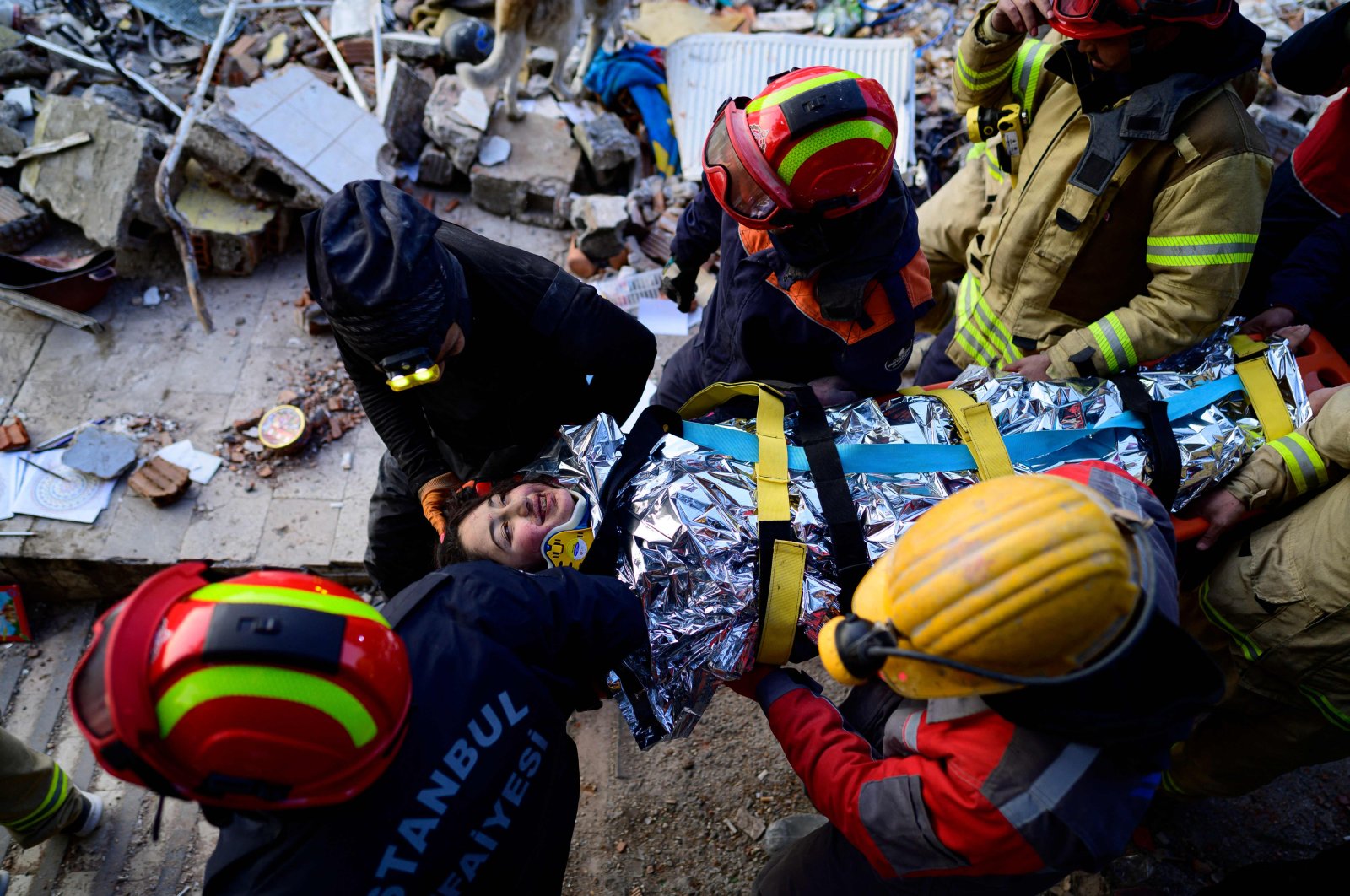 Rescuers evacuate a 12-year-old girl, Cudi, from the rubble, in Hatay, southern Türkiye, Feb. 12, 2023. (AFP Photo)