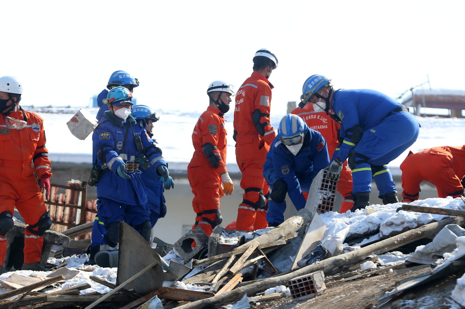 Blue Sky Rescue (BSR) teams sift through debris in Malatya, southern Türkiye, Feb. 11, 2023. (AA Photo)