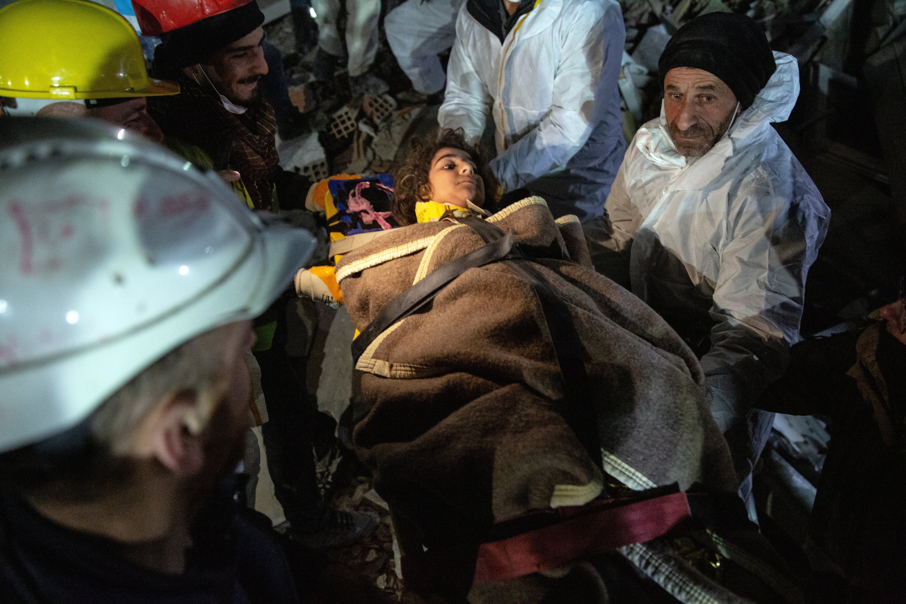 Rescue team members carry 11-year-old Lena Maradini rescued 160 hours after the earthquake, in Hatay, southern Türkiye, Feb. 12, 2023. (EPA Photo)