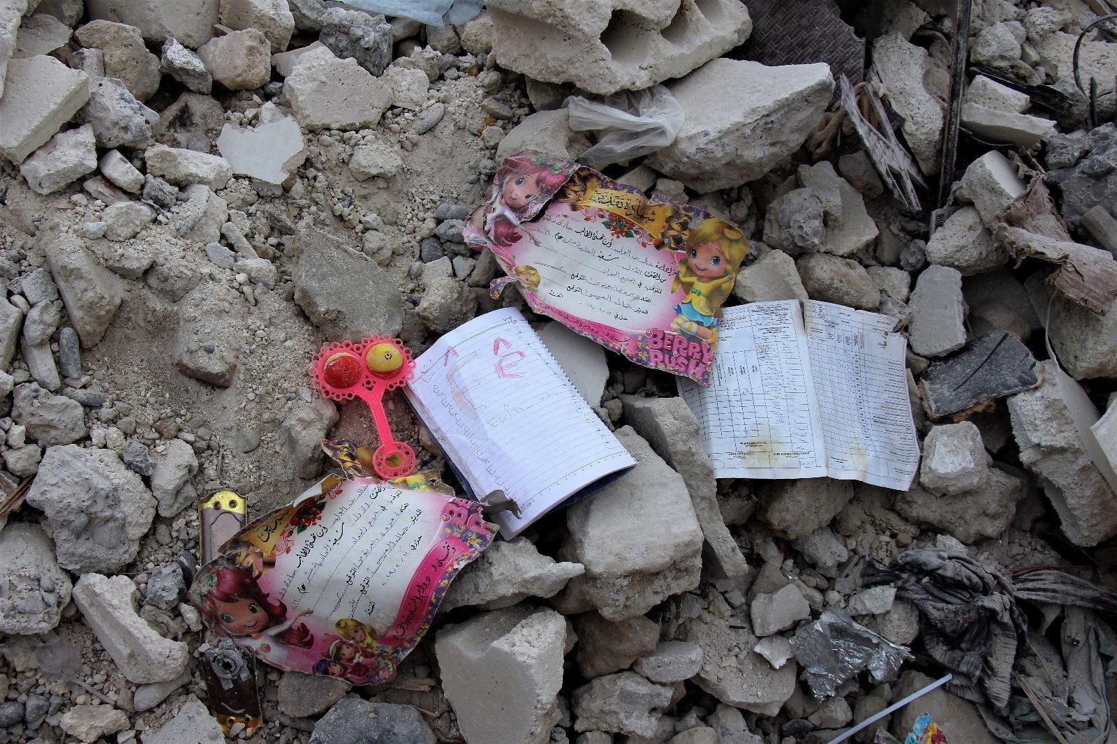 School books and certificates found by White Helmets members lay on the rubble, in the aftermath of an earthquake, Jandaris, Syria, Feb. 10, 2023. (Reuters Photo)