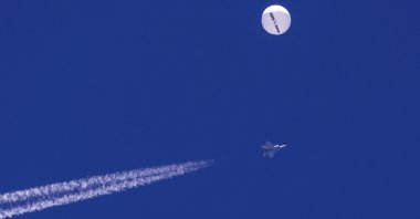 A U.S. F-22 fighter jet flies near a suspected Chinese spy balloon above the Atlantic Ocean, off the coast of South Carolina, U.S., Feb. 4, 2023. (AP Photo)