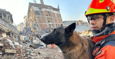 A rescuer from South Korea amid the ruins of a collapsed building in Hatay, southeastern Türkiye, Feb. 13, 2023. (AA Photo)