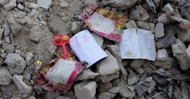 School books and certificates found by White Helmets members lay on the rubble, in the aftermath of an earthquake, Jandaris, Syria, Feb. 10, 2023. (Reuters Photo)