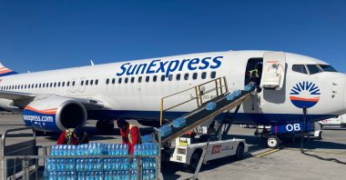 A SunExpress plane is loaded with cargo to be transported to earthquake zones in Istanbul, Türkiye, Feb. 9, 2023. (DHA Photo)
