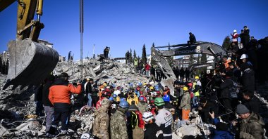 Search and rescue teams work to remove 18-year-old Muhammed Cafer Çetin from the rubble in Adıyaman province 198 hours after the deadly earthquakes struck southeastern Türkiye, Feb. 14, 2023. (AA Photo)