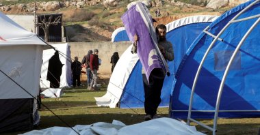 Displaced Syrians who lost their homes during the earthquake set up tents in a schoolyard, Harem, northwestern Syria, Feb. 13, 2023. (Reuters Photo)
