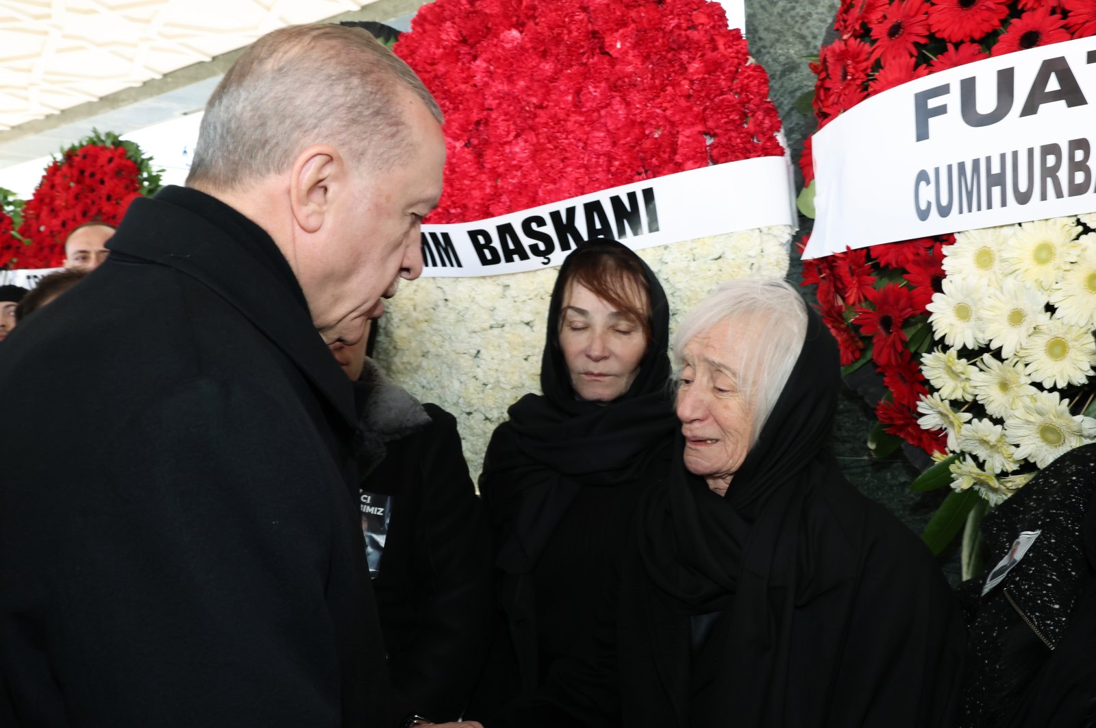 President Recep Tayyip Erdoğan extends condolences to former CHP Chair Deniz Baykal&#039;s wife Olcay (L) and daughter Aslı (R) at the funeral, in the capital Ankara, Türkiye, Feb. 14, 2023. (AA Photo)