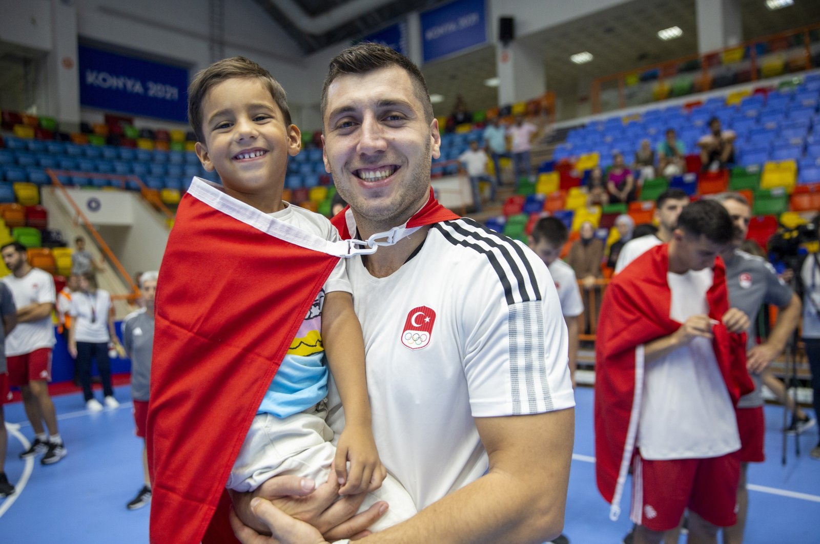 Cemal Kütahya, the captain of Türkiye&#039;s national handball team and his son, Çınar, smile after a game in this undated photo released on Feb. 13, 2023. (DHA File Photo)