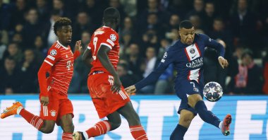 Paris St Germain's Kylian Mbappe in action with Bayern Munich's Kingsley Coman and Dayot Upamecano in UEFA Champions League round of 16 tie at Parc des Princes, Paris, France, Feb.14, 2023. (Reuters Photo)