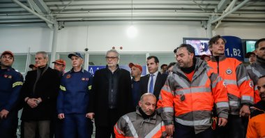 Greek emergency unit EMAK members pose for a picture at Athens Eleftherios Venizelos International Airport ahead of a press conference upon returning from a rescue mission in Türkiye's Hatay following deadly earthquakes, Greece, Feb. 13, 2023. (IHA Photo)