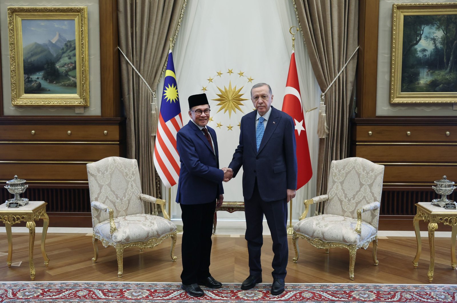President Recep Tayyip Erdoğan shakes hands with Malaysian PM Anwar Ibrahim at the presidential complex, in the capital Ankara, Türkiye, Feb. 15, 2023. (İHA Photo)
