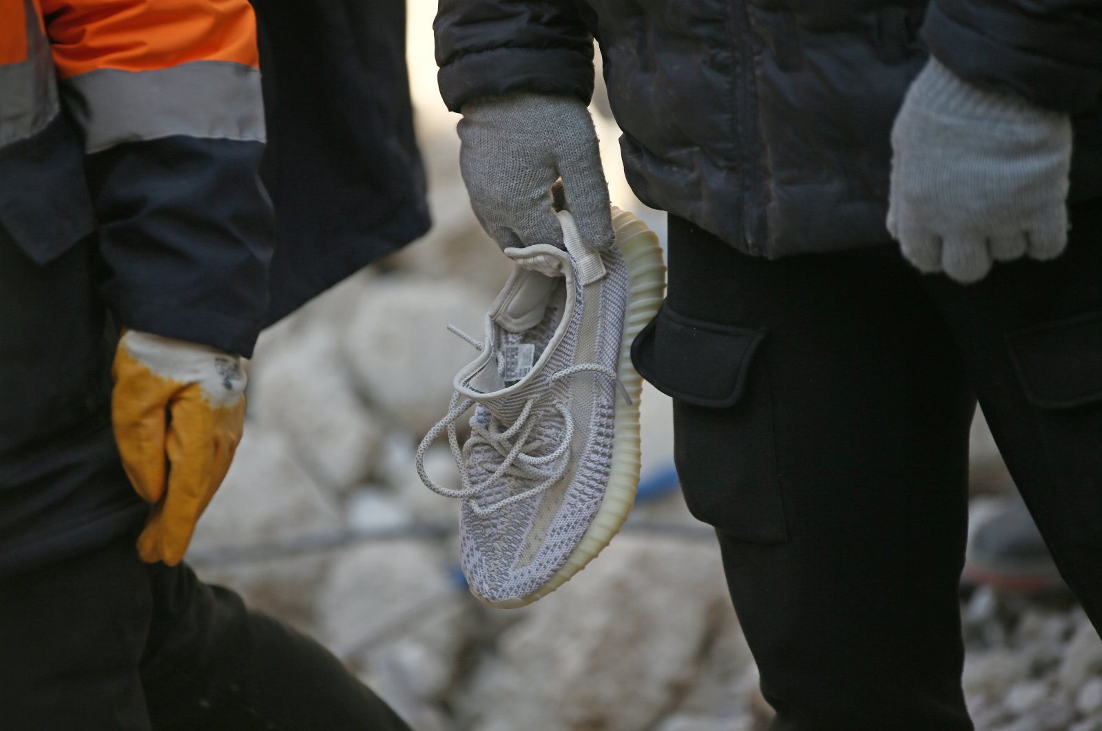 A shoe believed to belong to Hatayspor&#039;s Ghanaian football player Christian Atsu during search and rescue efforts in the wreckage of the Rönesans Residence, Hatay, Türkiye, Feb. 15, 2023. (AA Photo)