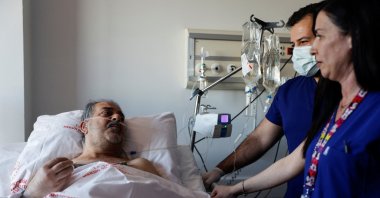 Hüseyin Berber, a survivor, speaks to media and doctors at a hospital, in Mersin, southern Türkiye, Feb. 15, 2023. (Reuters Photo) 