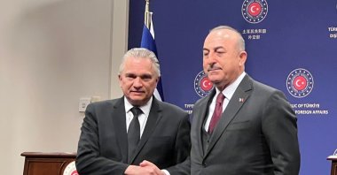 Foreign Minister Mevlüt Çavuşoğlu (R) shakes hands with Costa Rica FM Arnoldo Andre Tinoco (L) in the capital Ankara, Türkiye, Feb. 16, 2023. (İHA Photo)