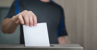 Man holds a ballot for elections at an unspecified location in this undated file photo. (Shutterstock File Photo)