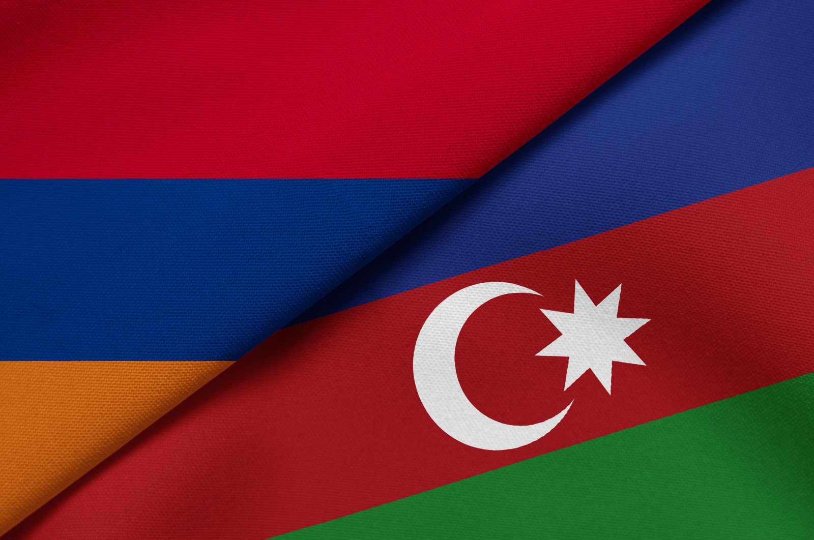 This photo illustration shows the national flags of Armenia and Azerbaijan. (Shutterstock Photo)