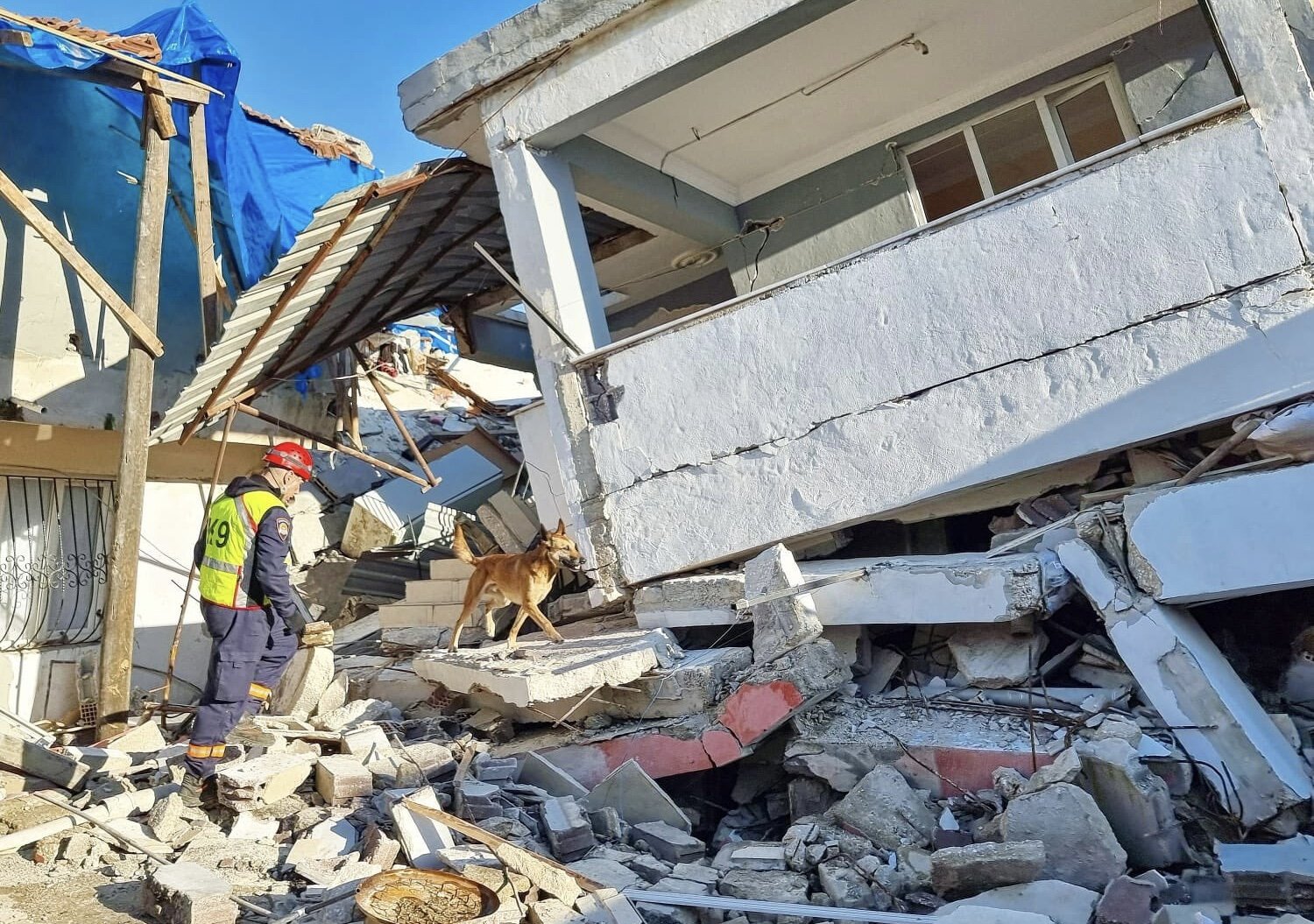 A rescue worker and dog are seen amid the debris following an earthquake in southern Türkiye, Feb. 15, 2023. (Courtesy of the Croatian consulate)