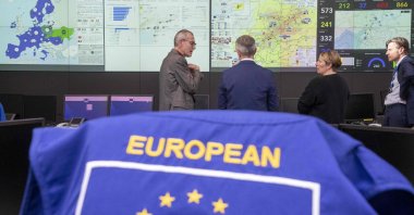 Vice Prime Minister and Public Health and Social Affairs Minister Frank Vandenbroucke (L), Director for Emergency Management and Rescue in the Directorate-General for European Civil Protection and Humanitarian Aid Operations of the European Commission Hans Das (C) and Minister for Development Cooperation and Metropolitan Policy Caroline Gennez (C right) visit the European Commission Emergency response coordination center from where the commıssion is currently coordinating European aid to earthquake victims in Türkiye and Syria, Brussels, Belgium, Feb.15, 2023. (AFP Photo)