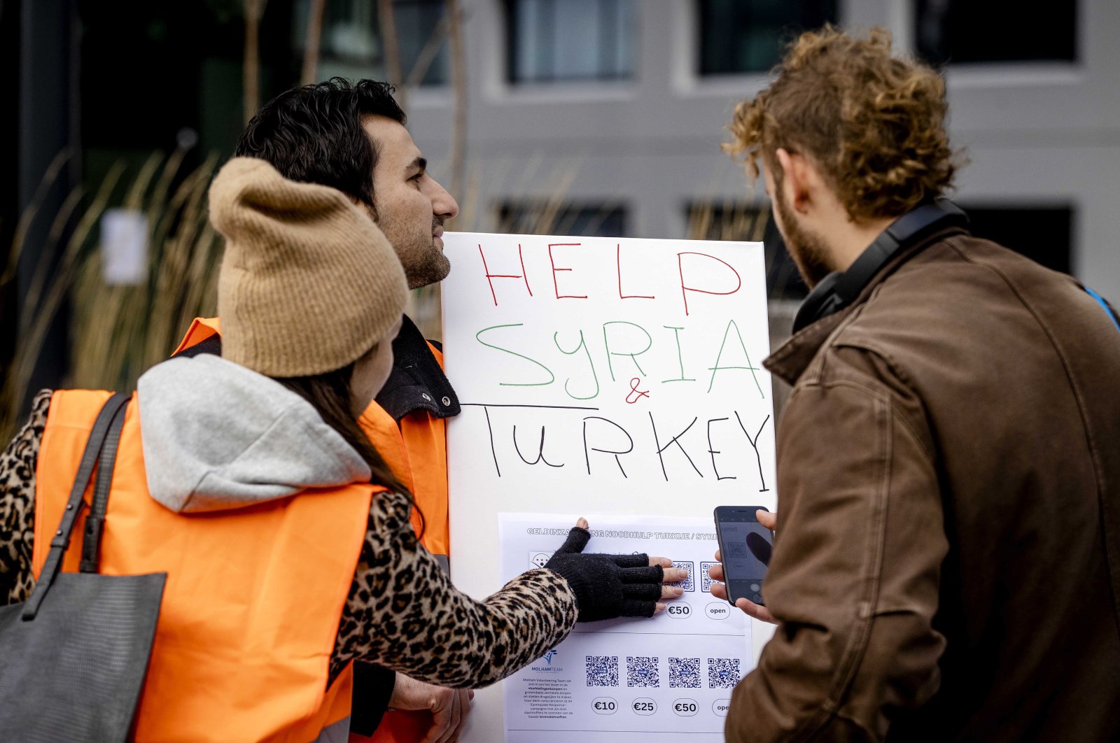Local volunteers collect money for the victims of the earthquakes in Türkiye and Syria, in Utrecht, the Netherlands, Feb. 11, 2023. (EPA Photo)