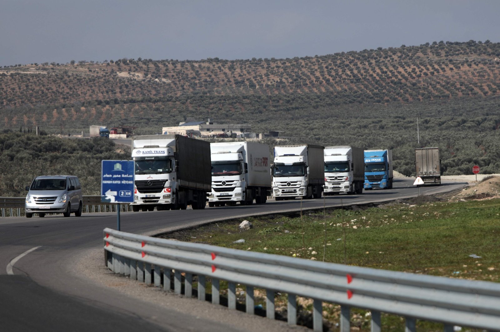 An aid convoy from Doctors Without Borders (MSF) enters Syria from Türkiye via the al-Hamam border crossing, Jindayris, northwestern Syria, Feb. 19, 2023. (AFP Photo)