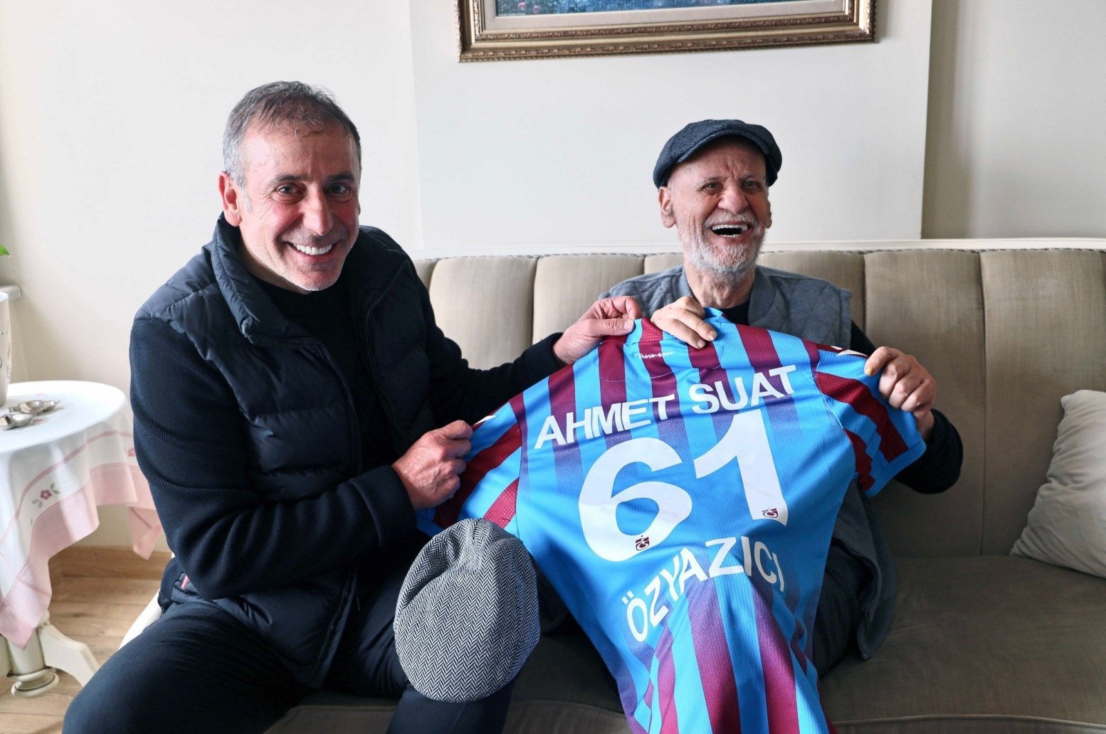 A file photo of Trabzonspor coach Abdullah Avcı handing over a jersey to former coach Ahmet Suat Özyazıcı, Istanbul, Türkiye, April 20, 2022. (IHA Photo)