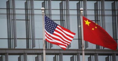 Chinese and U.S. flags flutter outside the building of an American company in Beijing, China, Jan. 21, 2021. (Reuters Photo)