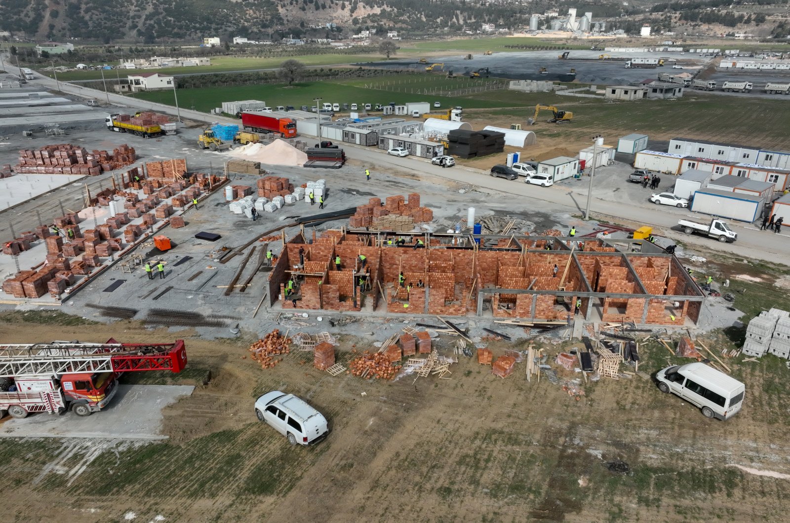 The construction of temporary shelters for Feb. 6 earthquake victims is underway in Gaziantep&#039;s Nurdağı and Islahiye district, Gaziantep, southern Türkiye, Feb. 19, 2023. (AA Photo)