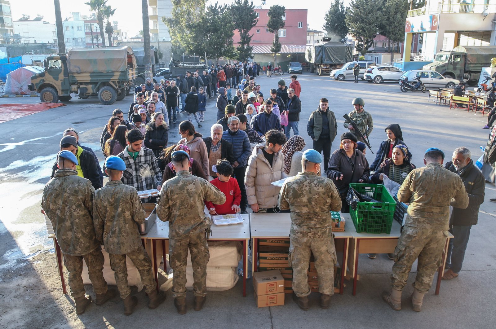 Soldiers deliver meals to earthquake victims, in Hatay, southern Türkiye, Feb. 17, 2023. (AA Photo) 