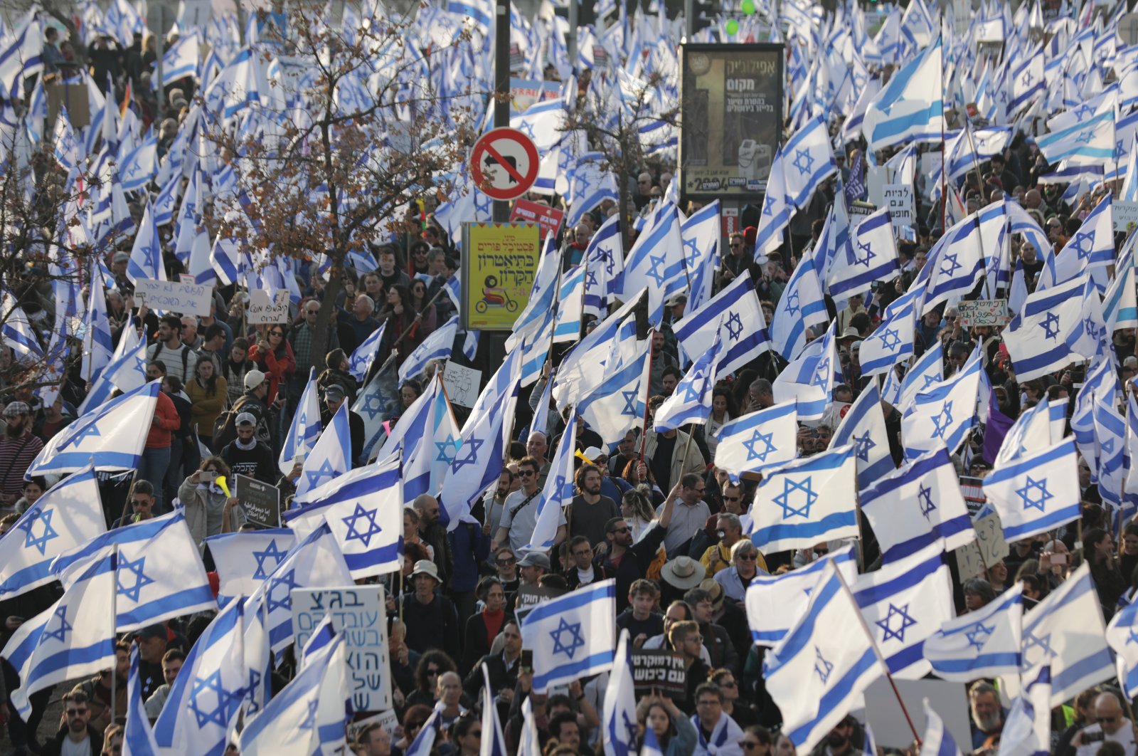 Israeli protesters wave flags during a mass anti-government demonstration outside the Israeli Knesset, Jerusalem, Israel, Feb. 20, 2023. (EPA Photo)