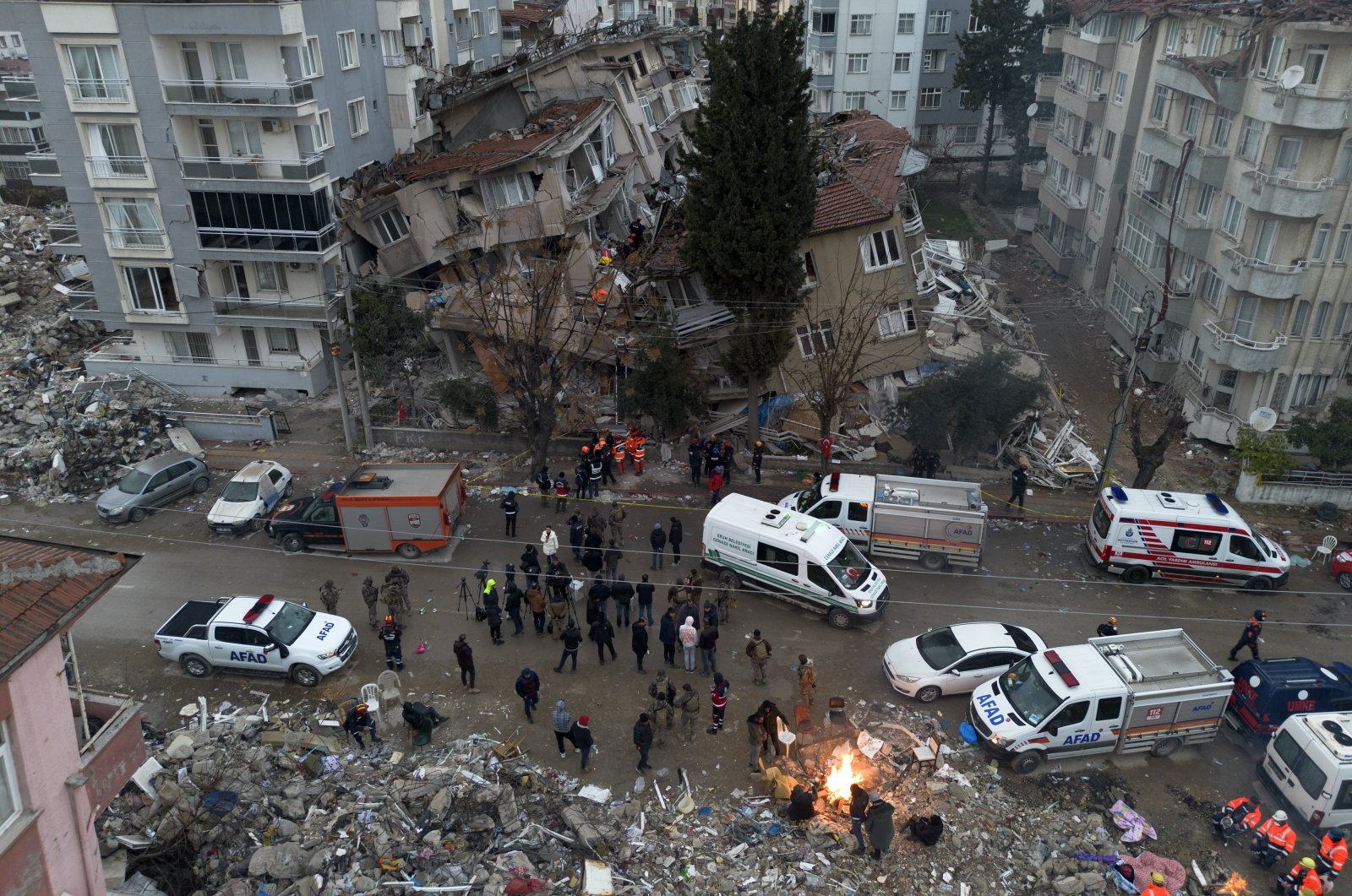 An aerial view shows people in chaos near collapsed buildings following the recent earthquakes in Hatay, Türkiye, Feb. 21, 2023. (IHA Photo)