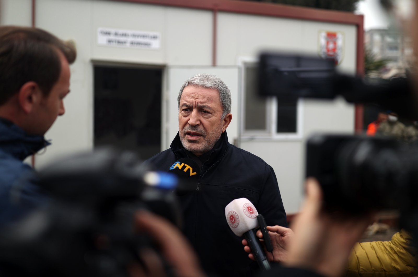 Defense Minister Hulusi Akar is seen in southern Hatay province&#039;s Defne district, there to examine the earthquake&#039;s fallout, Türkiye, Feb. 21, 2023. (AA Photo)