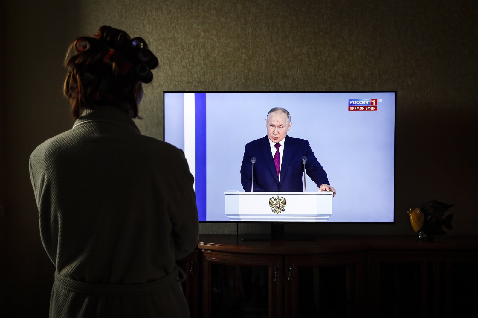 A woman watches the televised address by Russian President Vladimir Putin, Moscow, Russia, Feb. 21, 2023. (EPA Photo)
