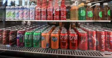 Bottles and cans of Coca-Cola imported from Japan and China, together with other soft drinks containers, displayed for sale in Vladivostok, Russia, Feb. 20, 2023. (Reuters Photo)