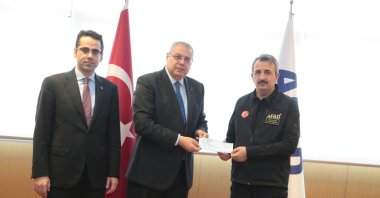 Algeria's Ambassador Sofiane Mimouni is seen presenting a donation in the amount of 30 million US dollars to Yunus Sezer, Director of AFAD, Ankara, Türkiye, Feb.21, 2023 (Courtesy of the embassy)