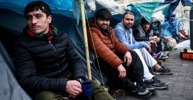 Migrants sit in their tents on the street in the center of Brussels, Belgium, Feb. 16, 2023. (EPA Photo)