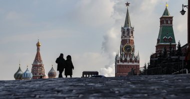 People walk on the Moscow Red Square prior to Russian President Vladimir Putin's annual state of the nation address, in Moscow, Russia, Feb. 21, 2023. (EPA Photo)