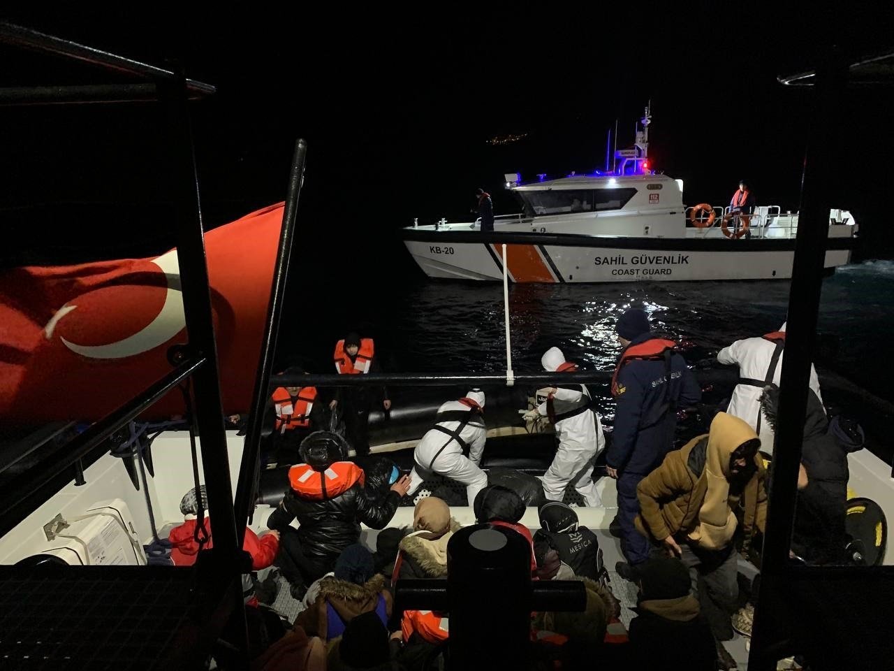 The Turkish coast guard helps irregular migrants stopped off the coast of Ayvacık, Çanakkale, northwestern Türkiye, Feb. 22, 2023. (İHA Photo)