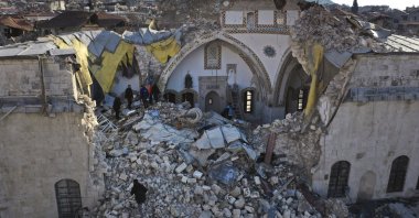 Turkish citizens check the historic Habib Najjar mosque which destroyed during the devastated earthquake, in the old city of Antakya, Türkiye, Feb. 11, 2023. (AP Photo)